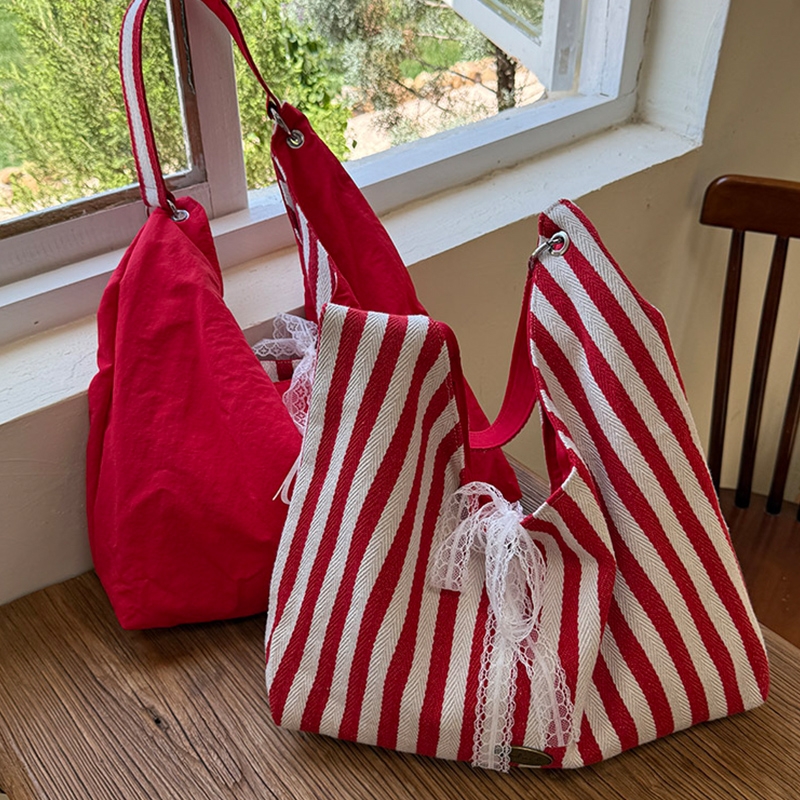 条纹帆布包包女秋天2025新款潮韩国字母印花双面单肩包学生上课包