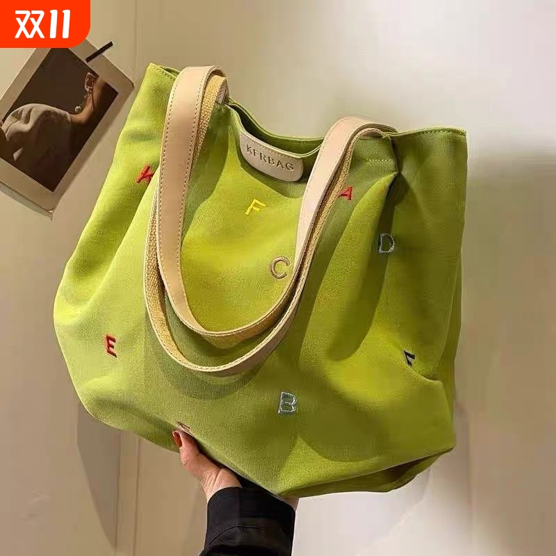 大容量帆布包包女2025新款简约百搭斜挎包休闲刺绣字母手提托特包
