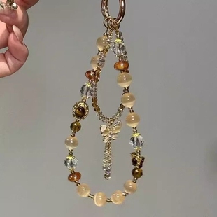 精致德虎眼色蝴蝶流苏手机链2025新款美拉百搭包挂件ccd相机发饰