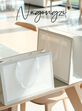 服装店袋子手提袋纸袋定制定做印刷logo童装女装纸袋子白卡礼品袋