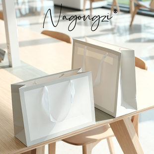 服装店袋子手提袋纸袋定制定做印刷logo童装女装纸袋子白卡礼品袋