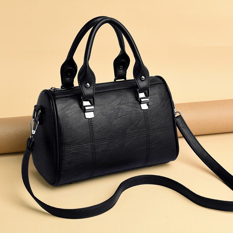 熙香奈女包旗舰店联名牛皮波士顿枕头女包2020新款简约大气手提包