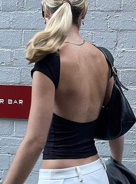 Backless top tight fitting short sleeved shirt exposed navel
