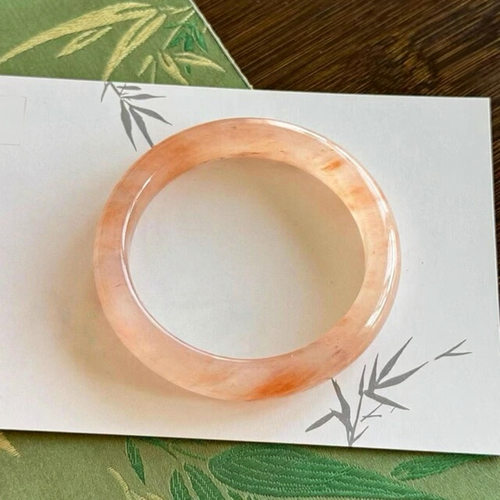 高冰透西柚色飘花金丝玉粉色手镯