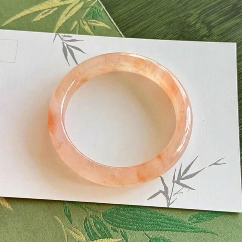 高冰透西柚色飘花金丝玉粉色手镯
