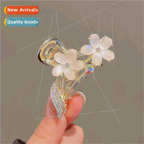 Premium sense cat eye stone flower grab clip female back hea
