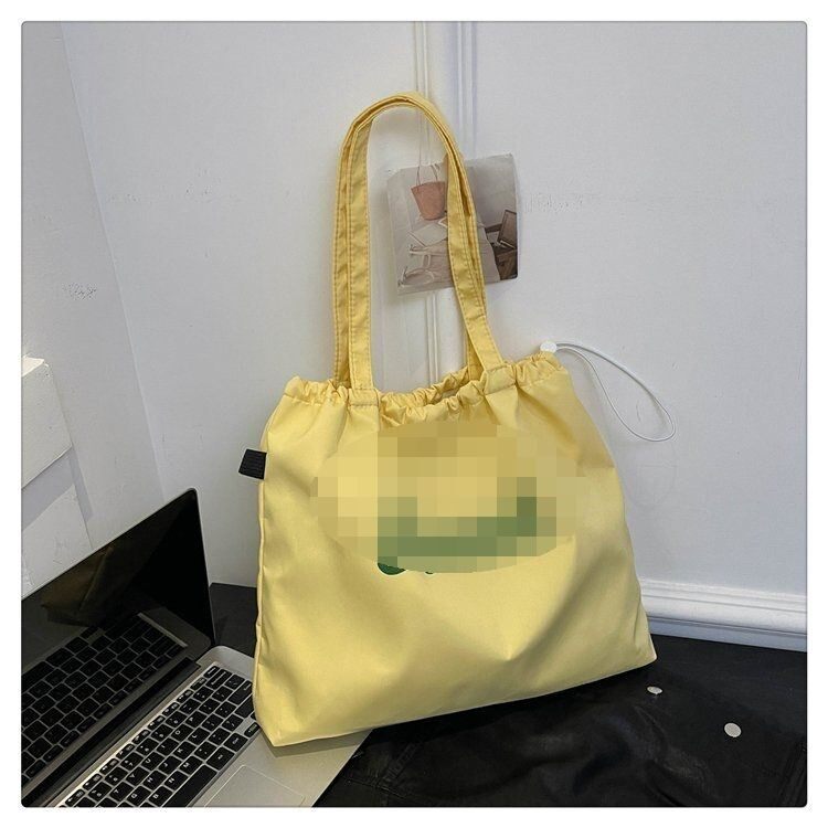 韩系字母简约慵懒文艺单肩帆布袋百搭通勤帆布包大容里抽绳购物袋