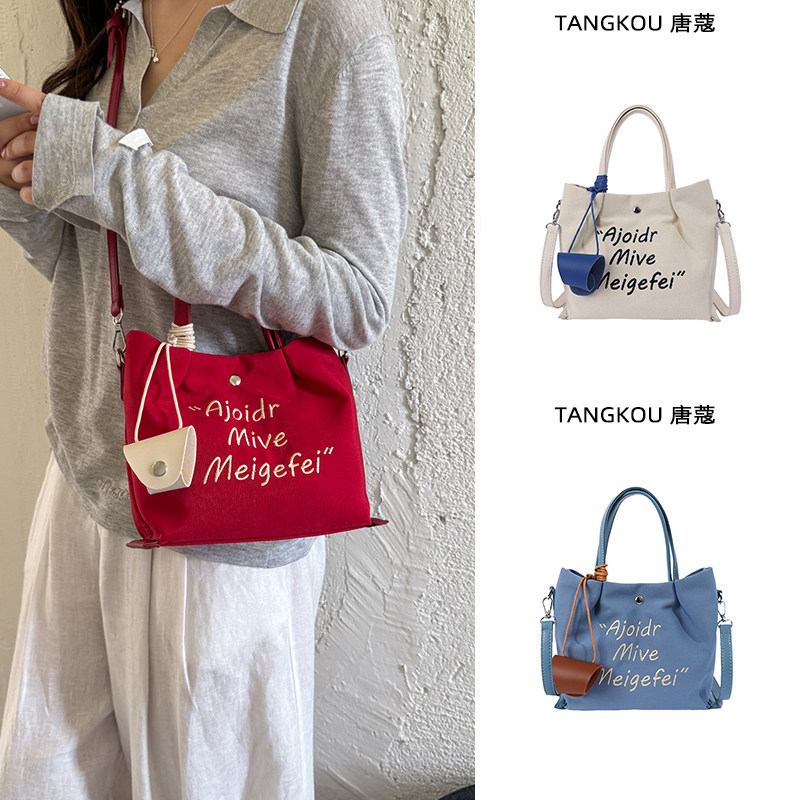 日韩红色帆布包女轻便旅行斜挎包外出妈咪包通勤手提托特包小拎包