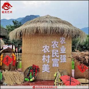 重庆农民丰收节道具展品制作稻草人造型丰收粮仓草堆草雕厂家