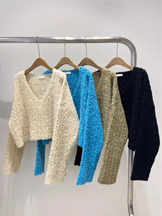 十三行2025秋冬新款设计感法式颗粒感显瘦大V领短款针织衫毛衣女