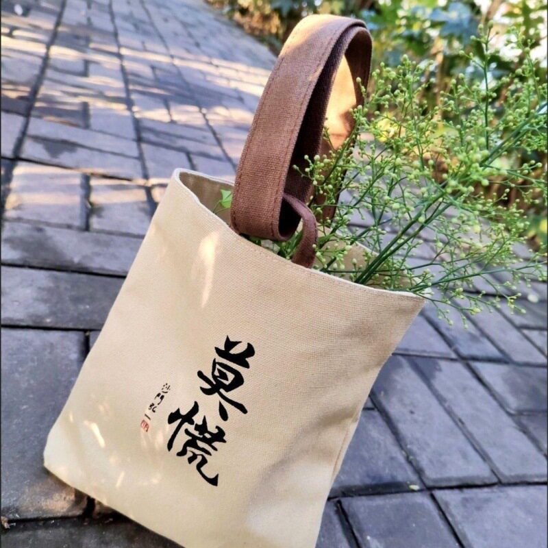 新款帆布包水桶包风书法印花随身