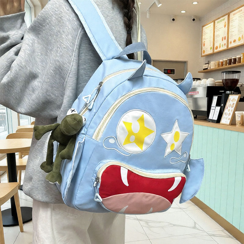 日系可爱小怪兽双肩包女大容量少女学生书包校园小众搞怪卡通背包