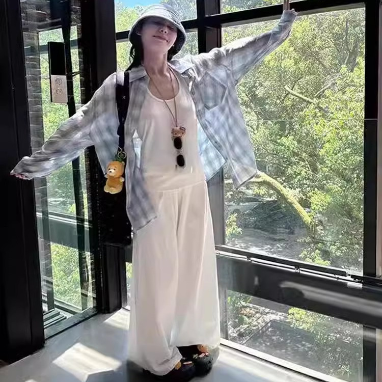 慵懒风小众别致格子衬衫女夏季2025新款宽松休闲蓝色防晒长袖上衣