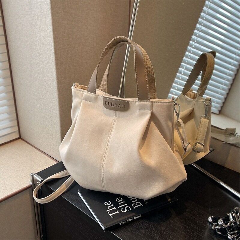 2026新款帆布手提包女士通勤百搭贝壳小包单肩包女斜挎包肩带可拆