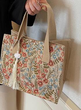 今年流行包包女2025新款麻布手提袋女ins上课通勤百搭碎花托特包
