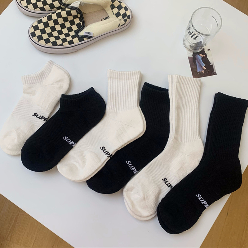 黑白纯色袜子毛巾底运动中筒长袜