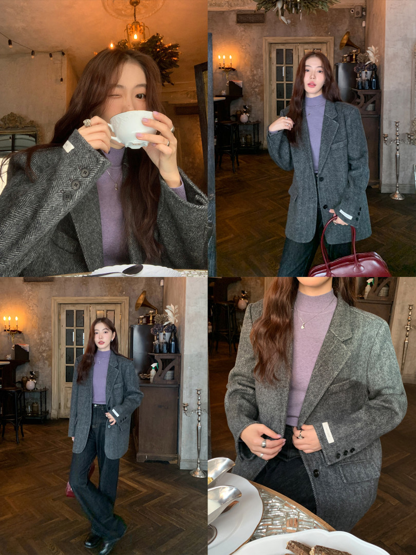 Woman modeling a gray blazer outfit with a lavender top and dark pants