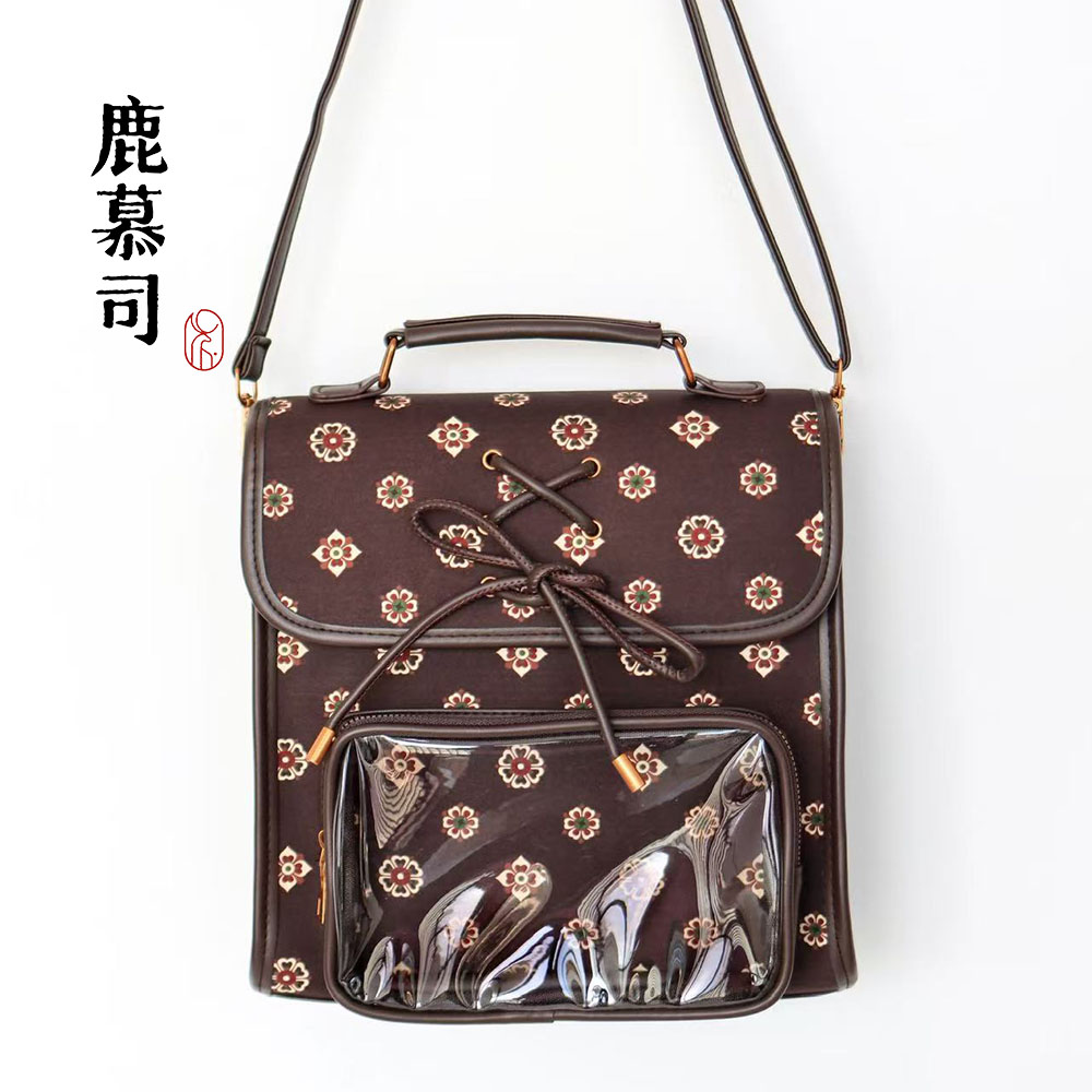 棕色蝴蝶结双肩痛包背包图片