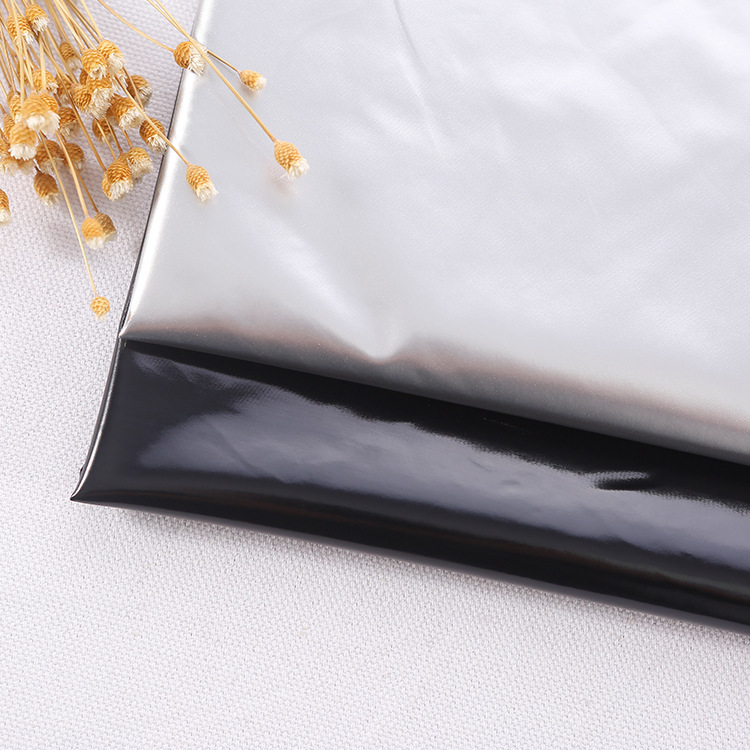 亮面pu面料镜面高亮离型纸防水羽绒服面料棉服羽绒服布料