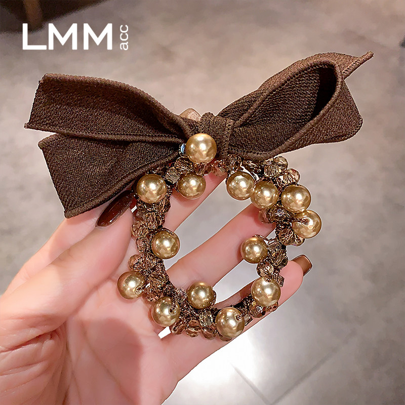 女高级感水晶蝴蝶结扎丸子头绳马尾头饰秋冬新款香槟色珍珠发圈