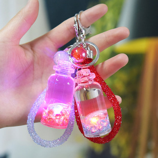 抖音网红漂浮牛奶瓶发光液体带灯挂件钥匙扣流沙漂流瓶入油包挂件