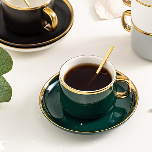 Classic ceramic coffee cup with gold handle creative design