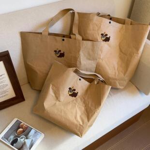 小狗牛皮纸手提包包新款卡通简约大容量托特包出差通勤百搭单肩包