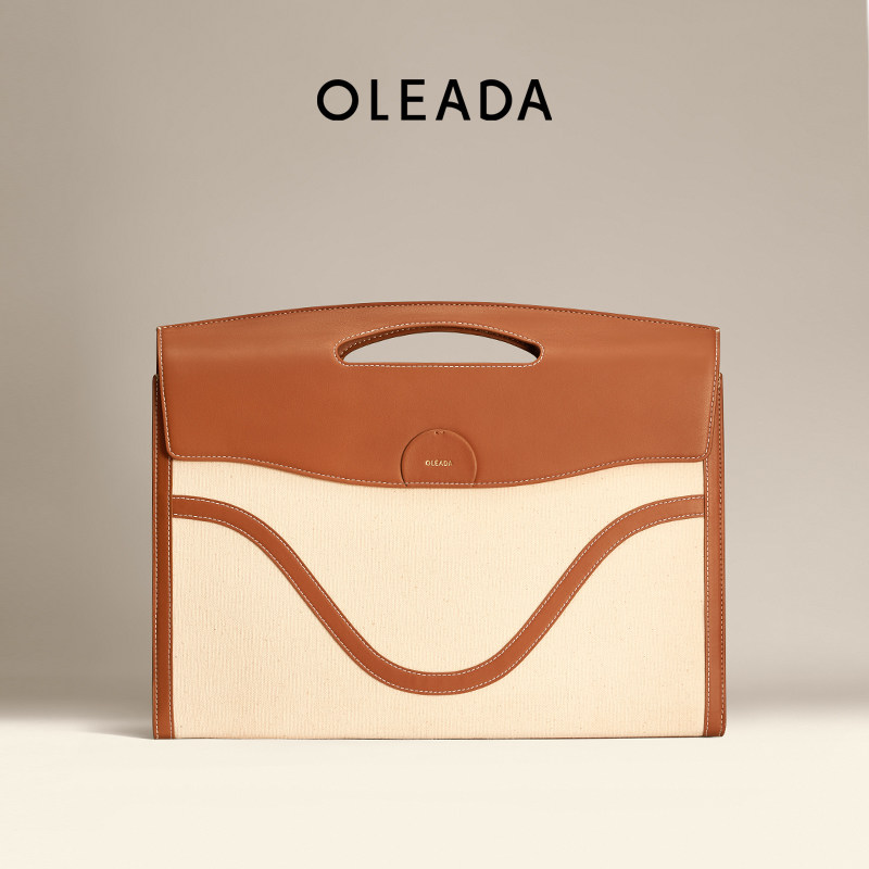 OLEADA信封包新品简约时尚手提包笔记本电脑皮套精致感职场包包女使用感如何?