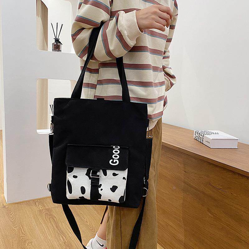 2025春夏季新款帆布单肩包三用简约大容量双肩包时尚牛奶纹斜挎包