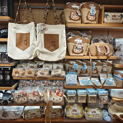名创优品hello kitty夏日黑皮化妆包手提包帆布包发夹MINISO