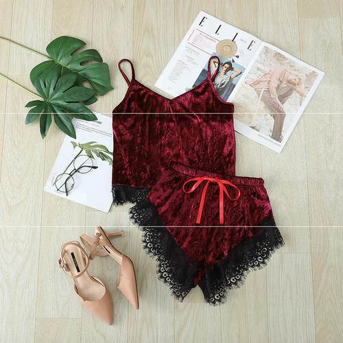 Two-piece pajama set with lace and bow shorts suspender top