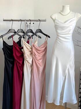 早春新款白色荡领缎面吊带连衣裙女收腰显瘦开叉中长款裙子