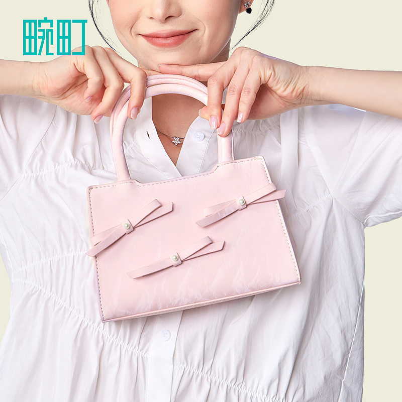 畹町清新蝴蝶结手提包