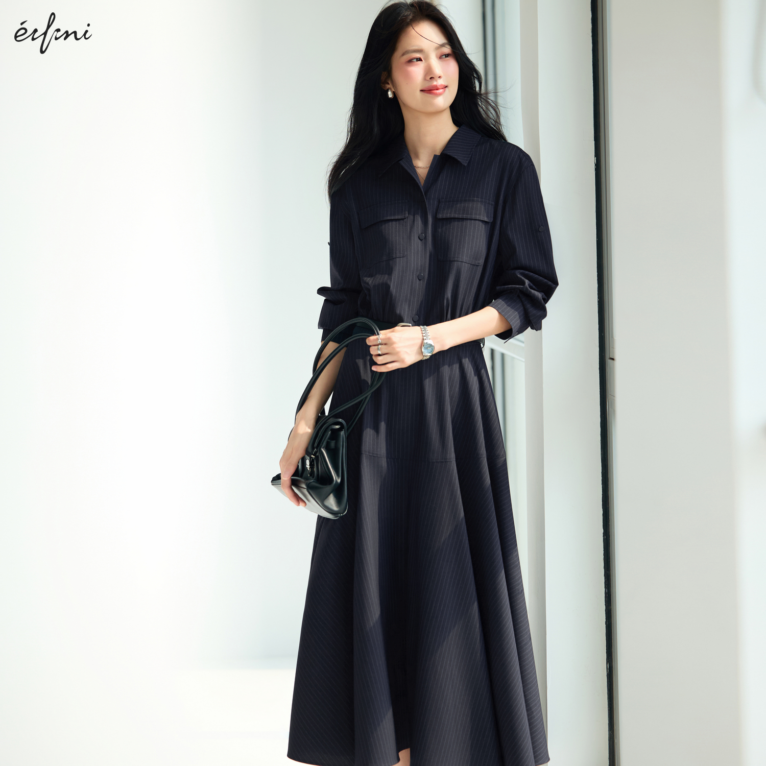 伊芙丽抗皱TR色纺显瘦展浪裙摆后腰牛筋舒适女裙2025秋装新款