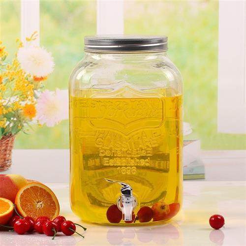 The glass jug bucket with tap water dispenser glass juice