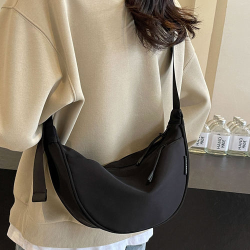休闲百搭帆布包包女2025新款夏天斜挎小包设计感小众饺子包手机包