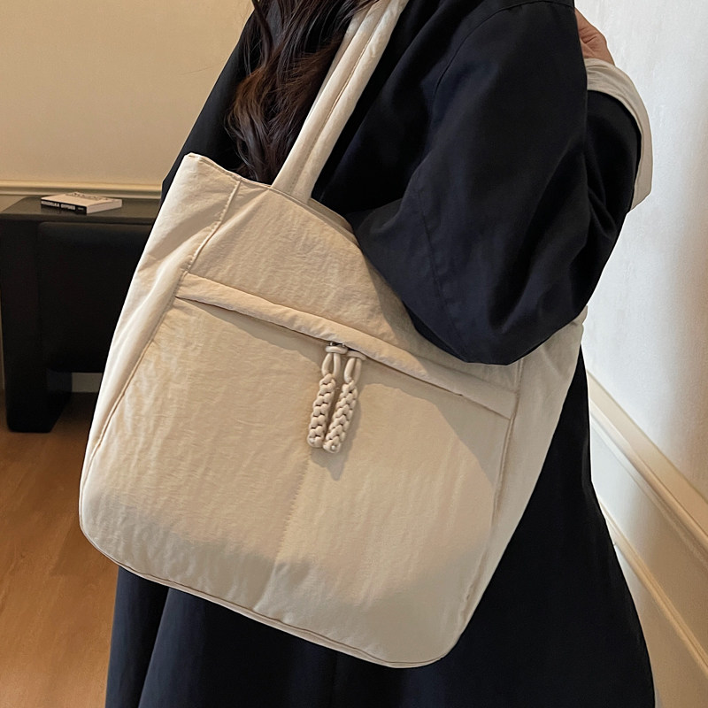 简约大容量帆布包女式2026新款秋冬韩国小众学生托特包百搭单肩包