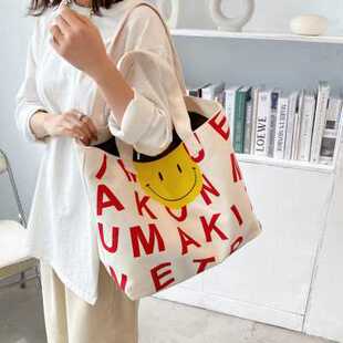 帆布手提印花字母大容量学生帆百搭单肩斜挎布袋包装书笑脸布袋子