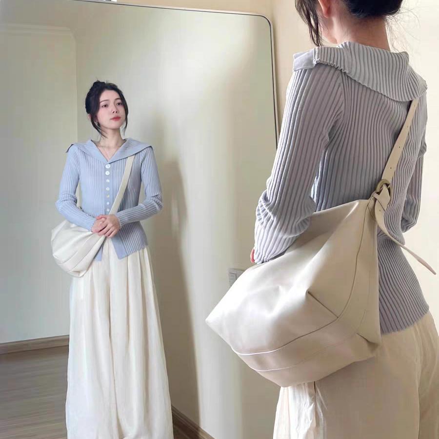 蓝色一字肩针织开衫女早秋穿搭修身显瘦内搭上衣独特别致减龄毛衣