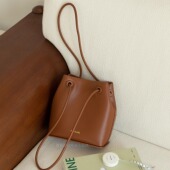 摩西奶奶 2025新款 牛皮水桶包单肩斜挎抽绳极简包 流光智性风包