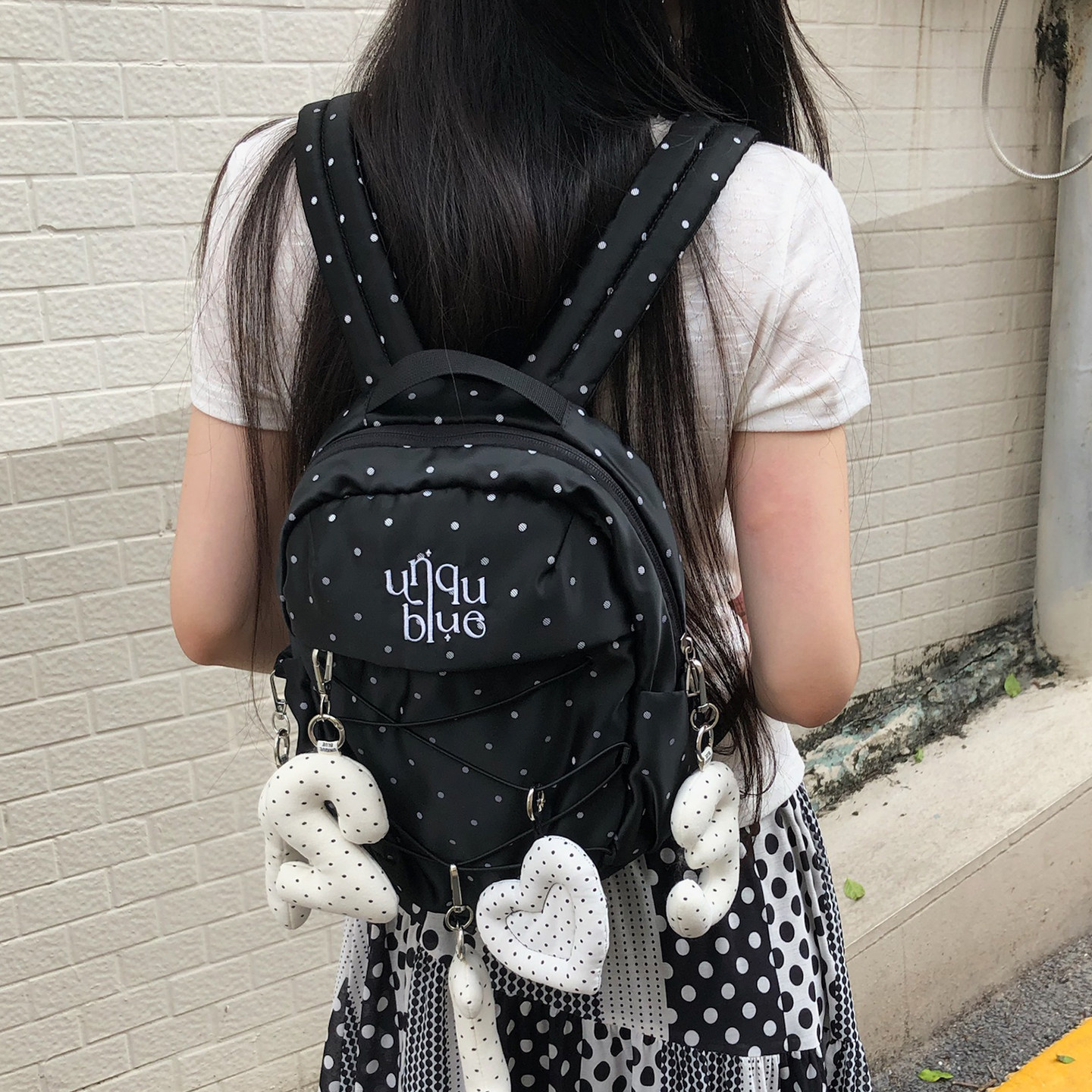 Unique blue韩系千禧氛围感抽绳黑色波点背包精致学生双肩包女