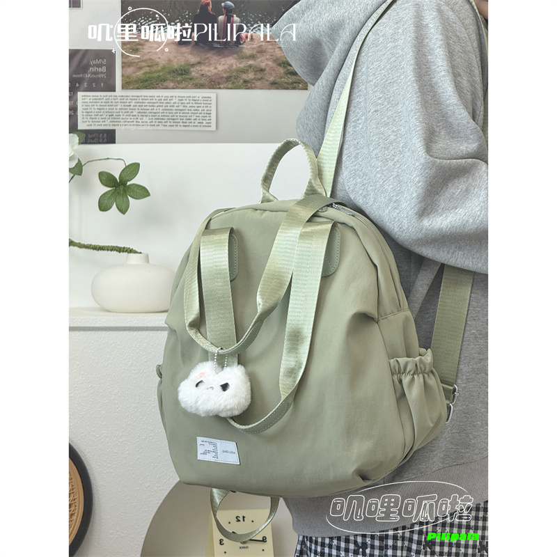 叽哩呱啦小众纯色贝壳包简约大容量双肩包一包两用轻便通勤妈咪包