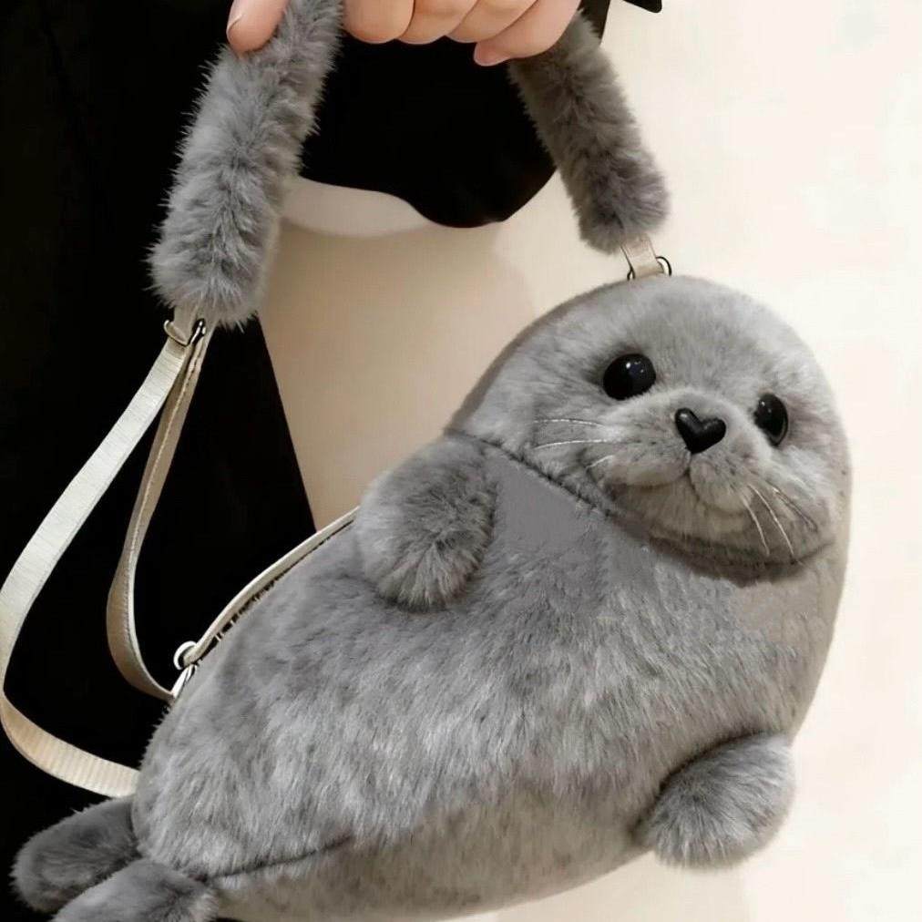 新款毛绒可爱少女心纯色单肩包韩系简约海豹卡通玩偶出行斜挎包女