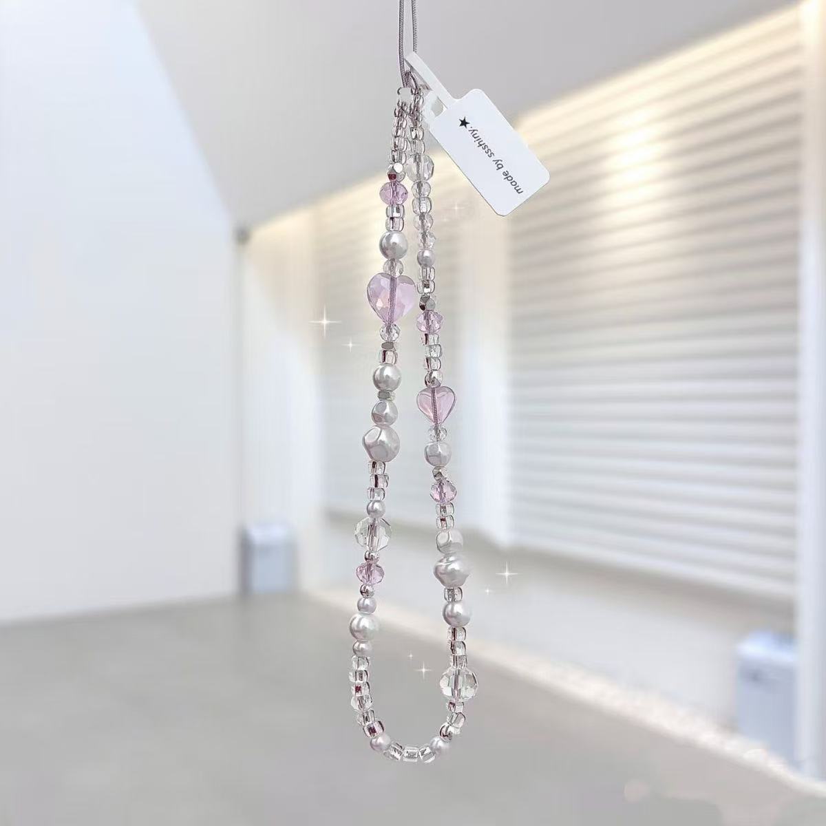 金洋壳爱心珍珠手机链新品促销