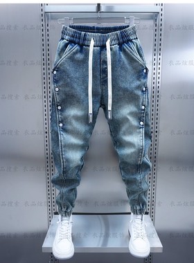 潮牌拼接蓝色工装牛仔裤2025新款排扣束脚休闲裤男宽松哈伦小脚裤