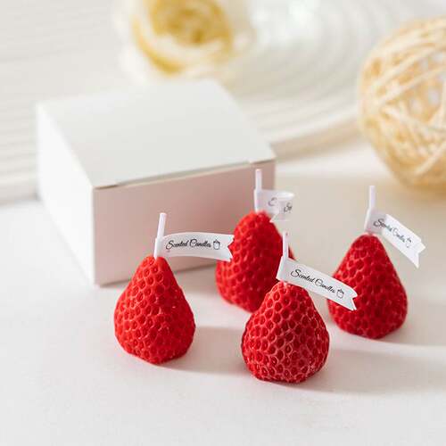 Boxed strawberry-shaped aromatherapy candles