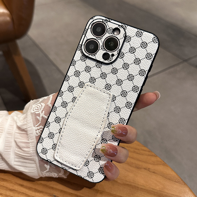 适用苹果15手机壳iphone15promax新款皮质潮牌老花料14pro手机套13全包12创意支架挽带指环男女por高级感plus