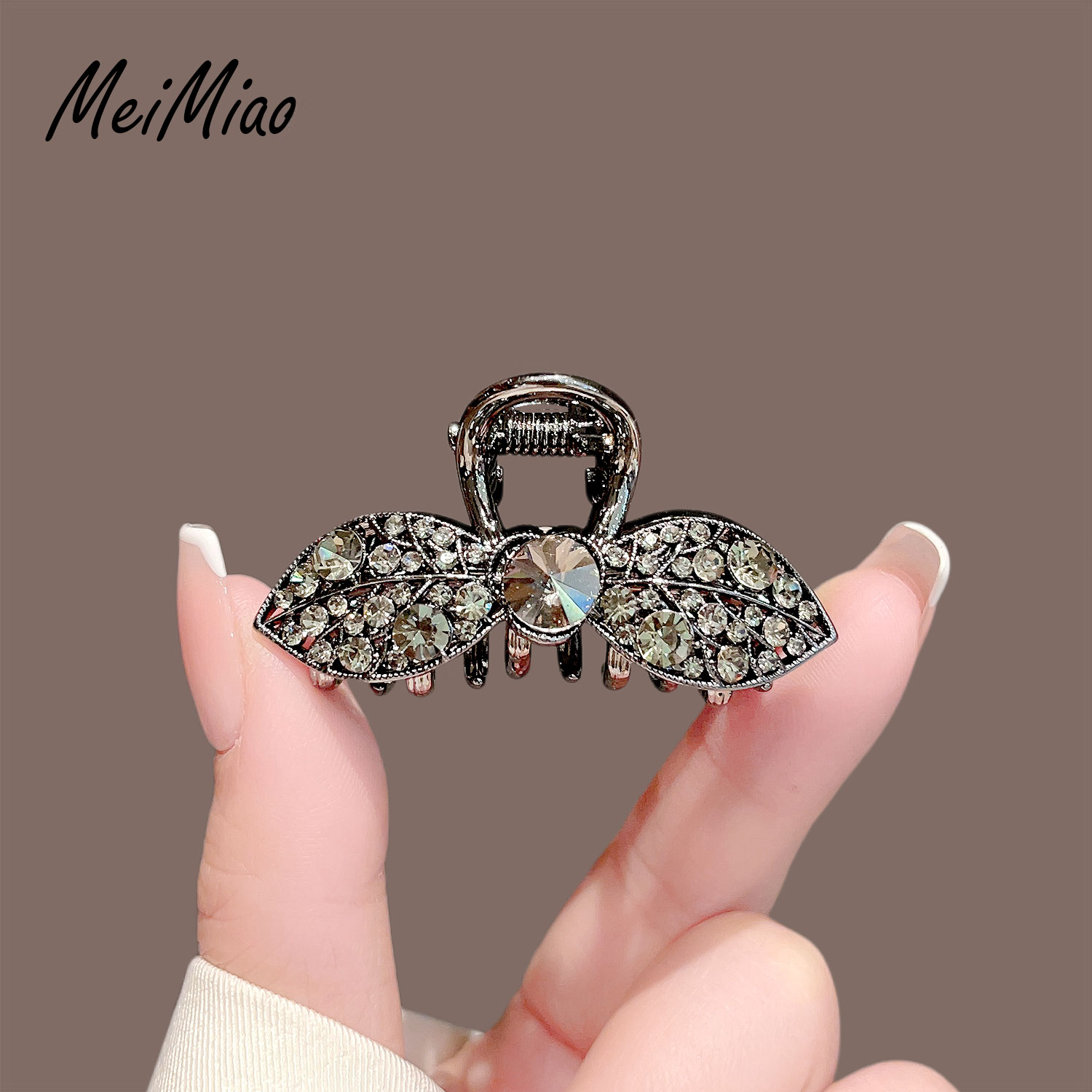 美苗~优雅气质黑色水钻树叶抓夹