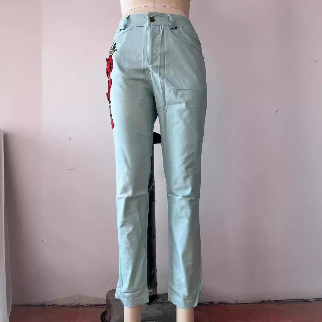 Elastic embroidered washed denim trousers in three colors