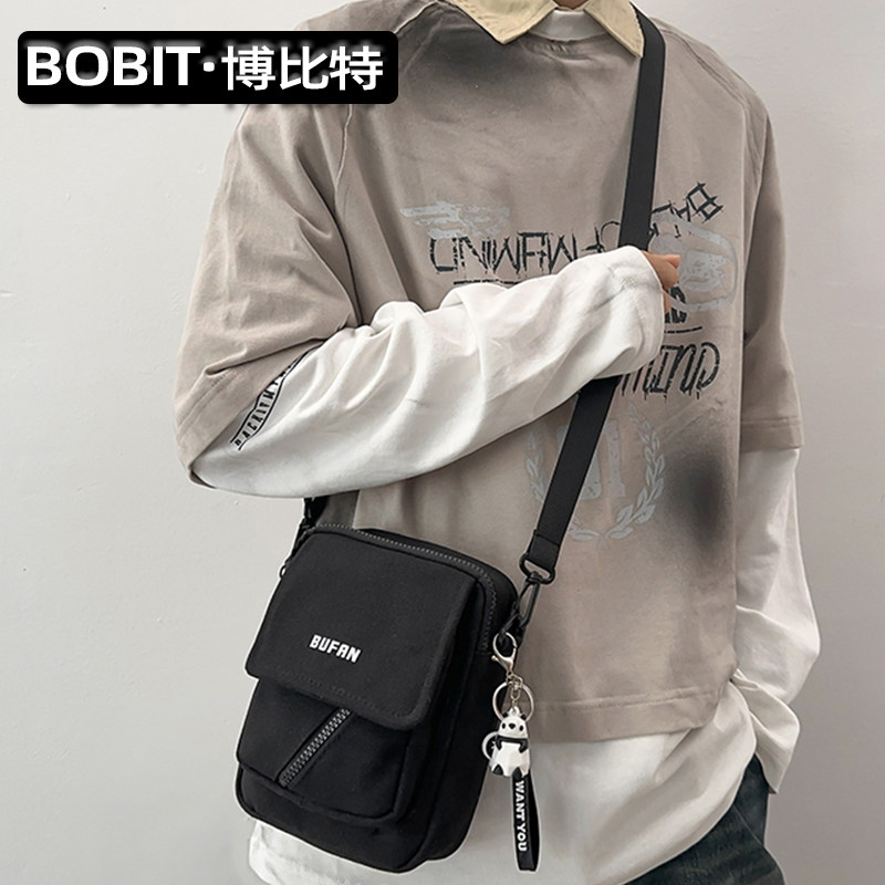 简约休闲单肩斜挎包手机帆布包图片